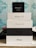Stack of electronic device boxes, including an Apple Watch Series 3 box on top, followed by two iPhone boxes, with model names iPhone 5S and iPhone 6S.
