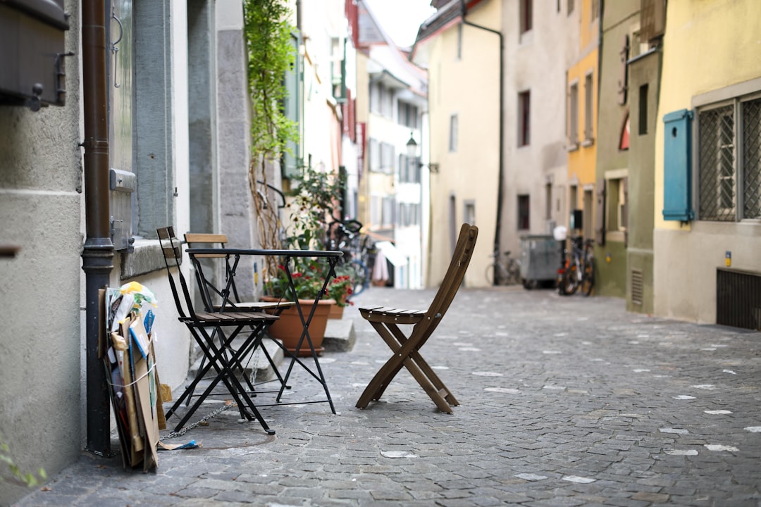 black table with chairs on pathway