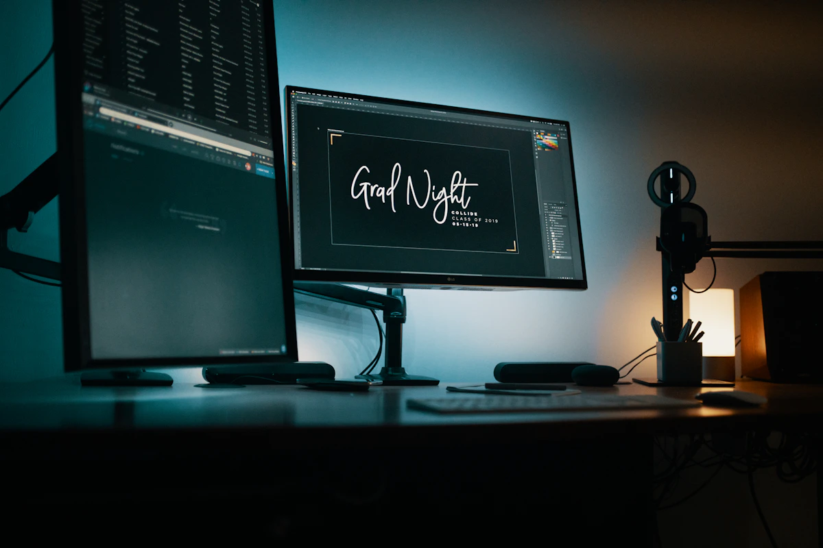 Design workstation with monitors in a dark studio