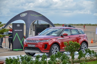 red SUV near tent