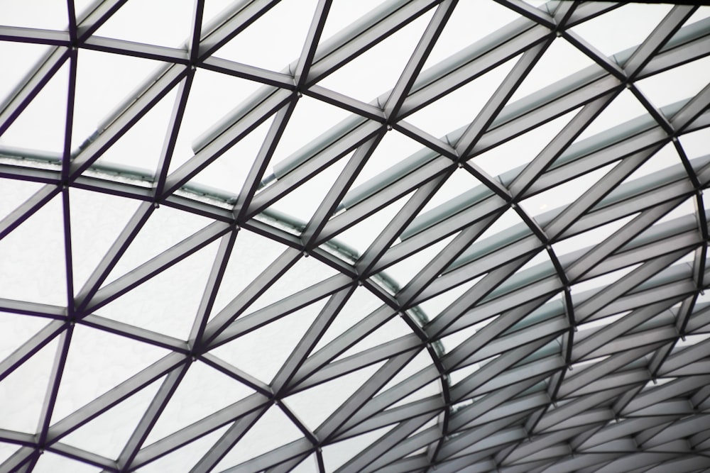 a close up of a metal structure with a sky background