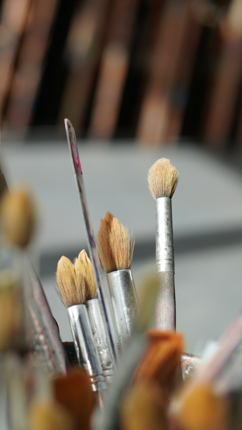 paint brushes on selective focus photography
