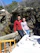 A happy couple enjoying a meal outdoors by the river at Nehirbahçe restaurant.
