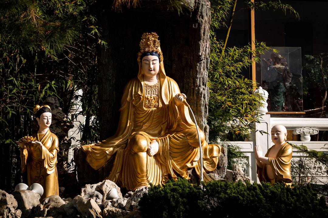 three Hindu deity statuettes