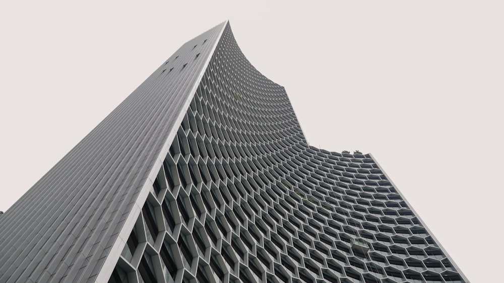 low angle photography of white concrete building during daytime