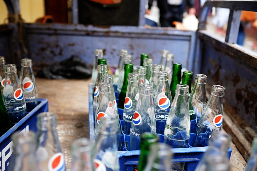 empty pepsi bottles on crates