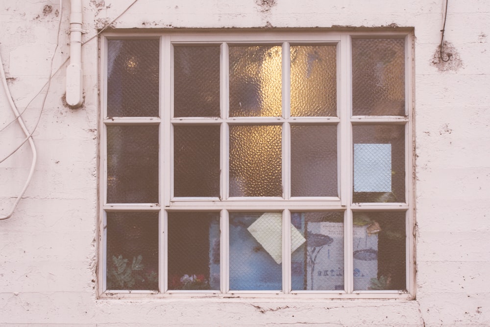 white framed clear glass window