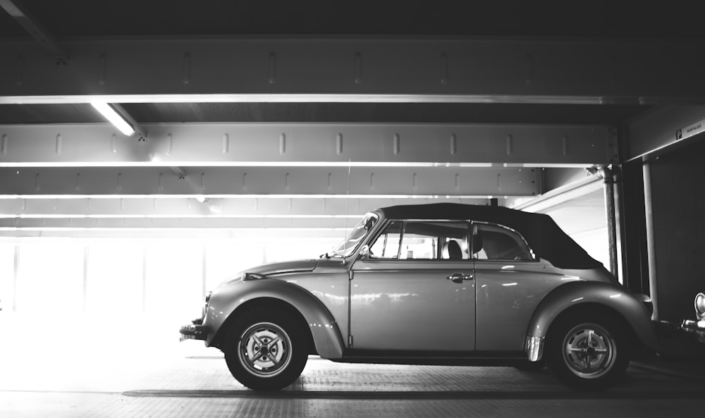 classic Volkswagen Beetle Cabriolet parked in parking lot