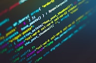 Lines of colorful code are displayed on a dark background, showcasing various programming functions and syntax. The text is highlighted in different colors to indicate different parts of the code, which includes strings, variables, and functions.