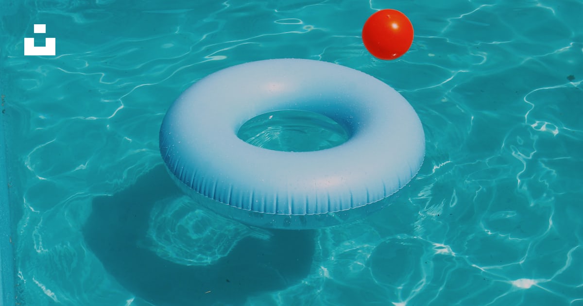 Pool ring floating on water photo – Free Blue Image on Unsplash