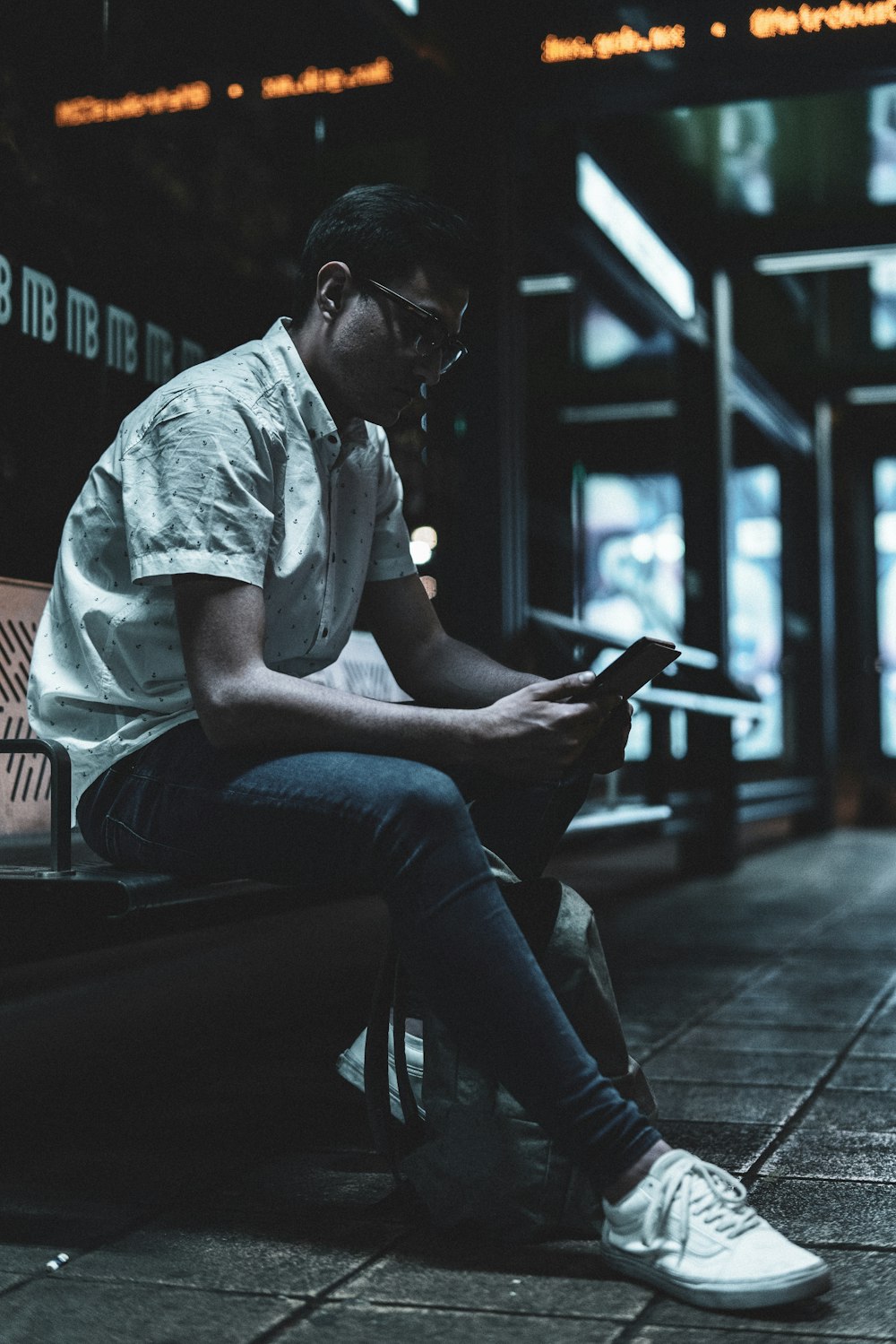 man sitting on bench