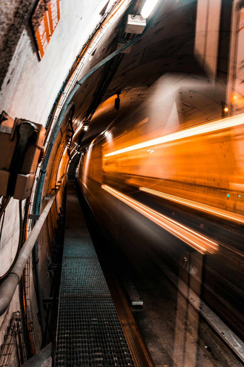 a blurry photo of a train going through a tunnel