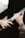 Two hands are reaching towards each other with an emotional and gentle gesture. The surroundings are blurred, focusing attention on the hands.