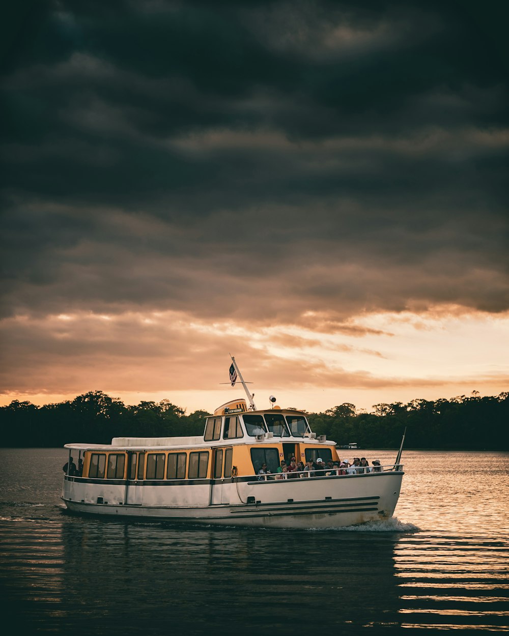 white boat under cloudy sky