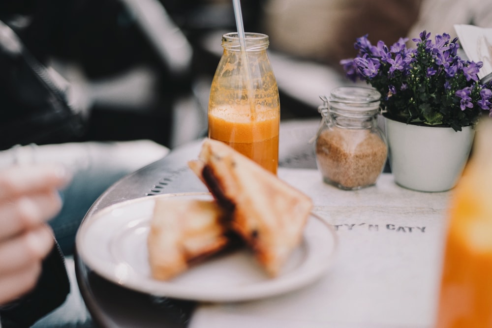 toasted bread on plate near bottle