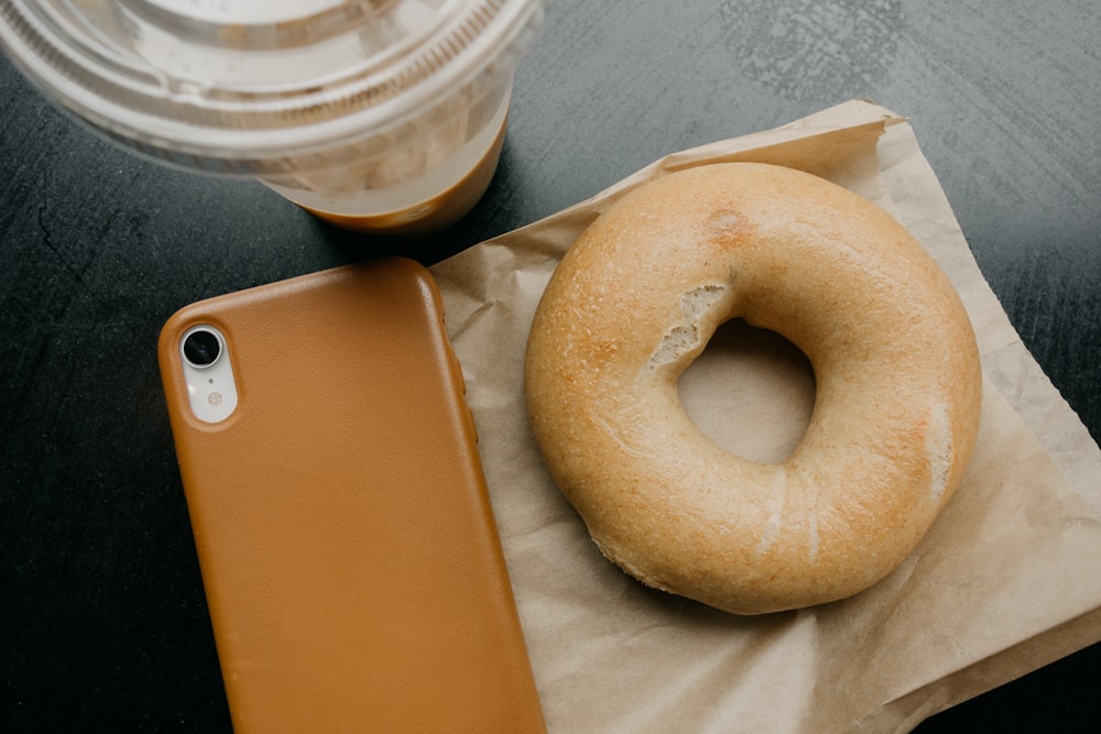 donut beside brown smartphone