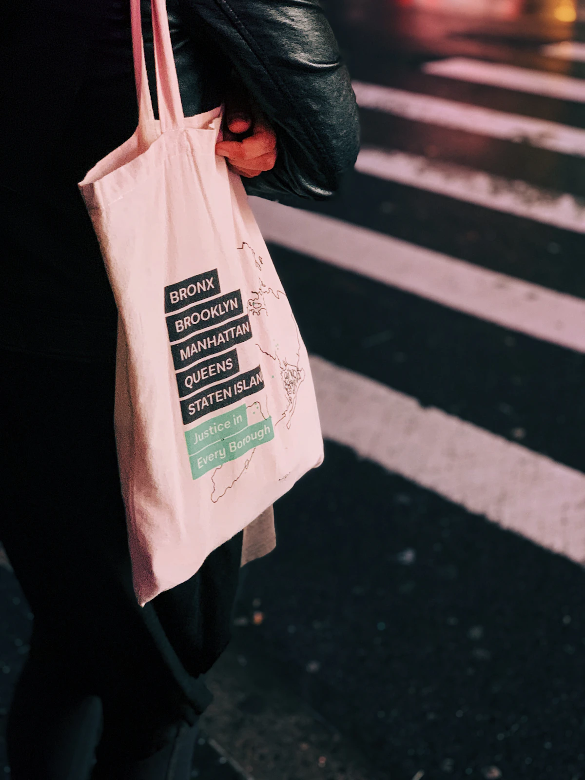 Person holding a canvas tote bag
