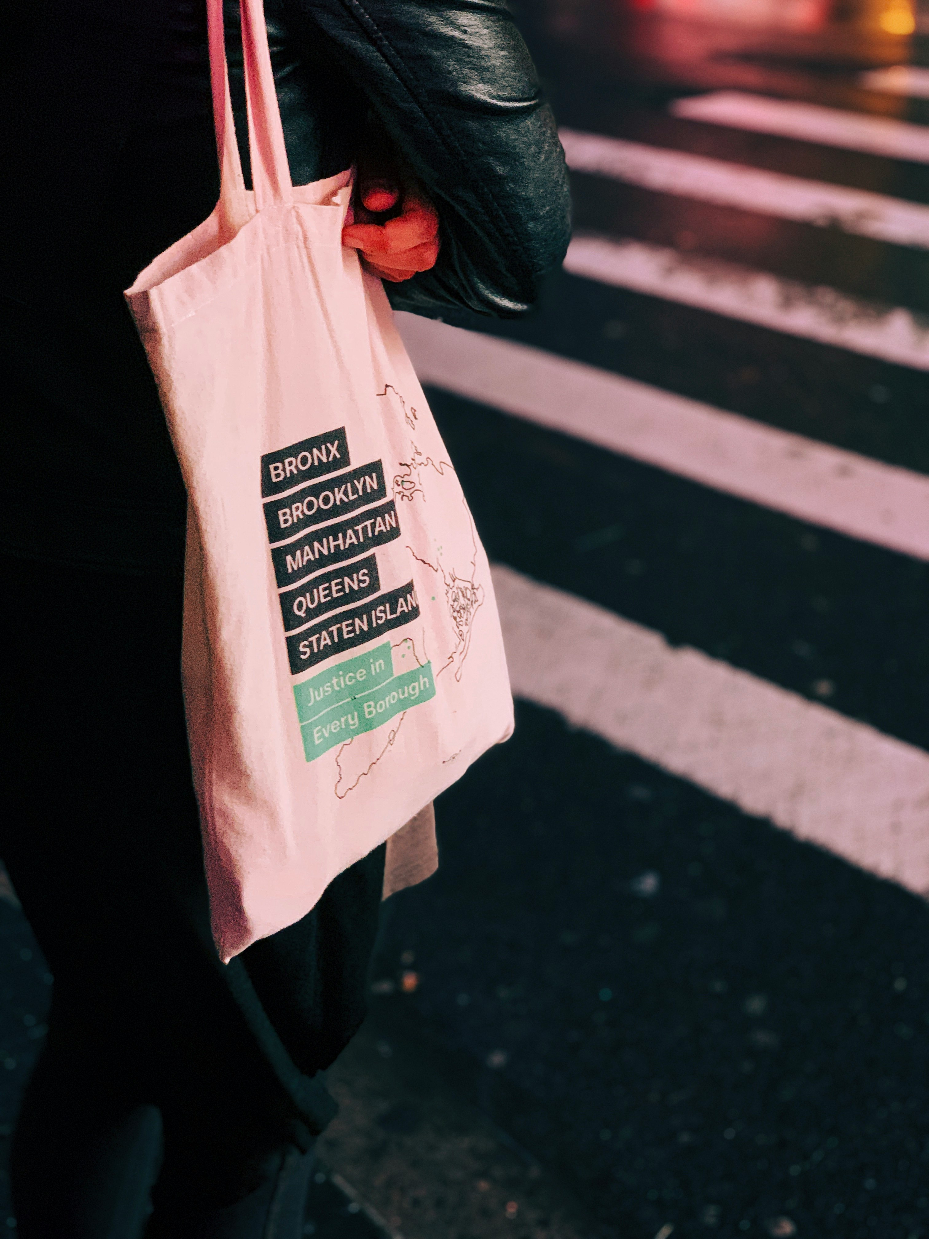 person holding tote bag