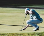 man holding black golf club