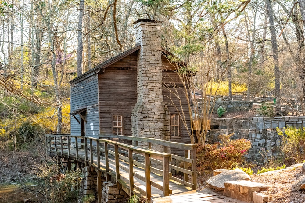 brown wooden house near bridge