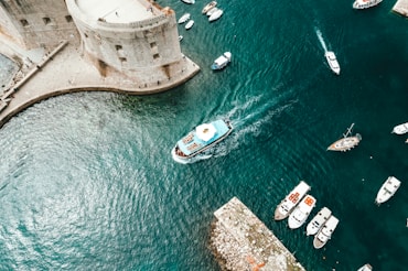 white boat near dockside