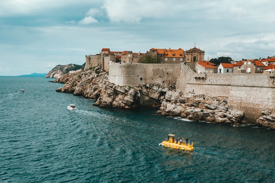 yellow boat on ocean