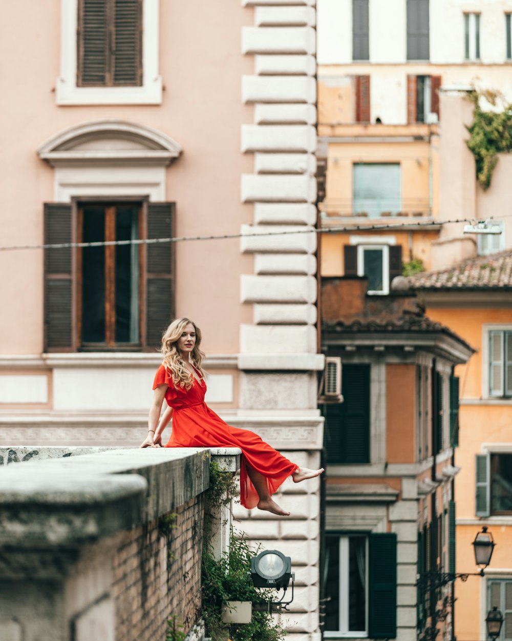 woman sitting on rooftop