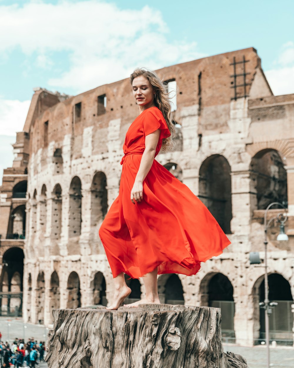 woman standing on stamp during daytime