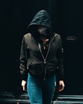 person in black zip-up hoodie