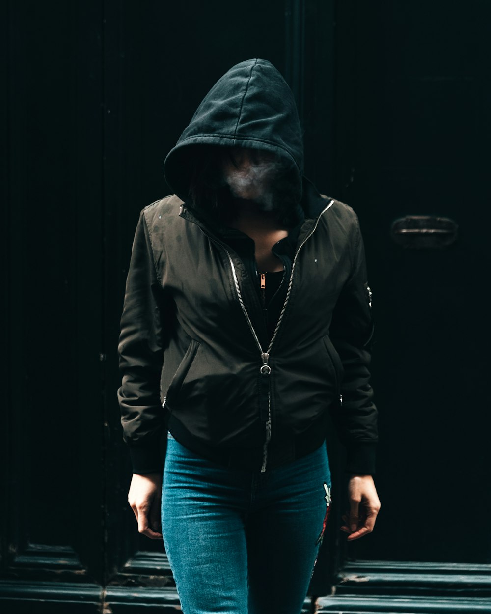 person in black zip-up hoodie