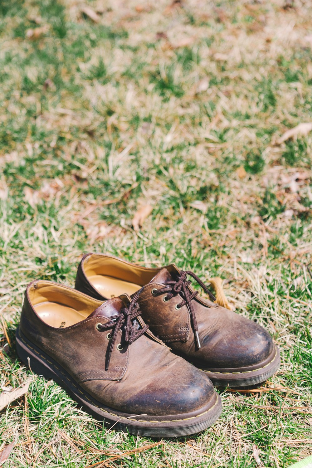 pair of brown leather lace-up shoes