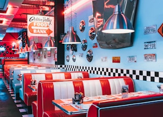 red padded sofa and tables inside building