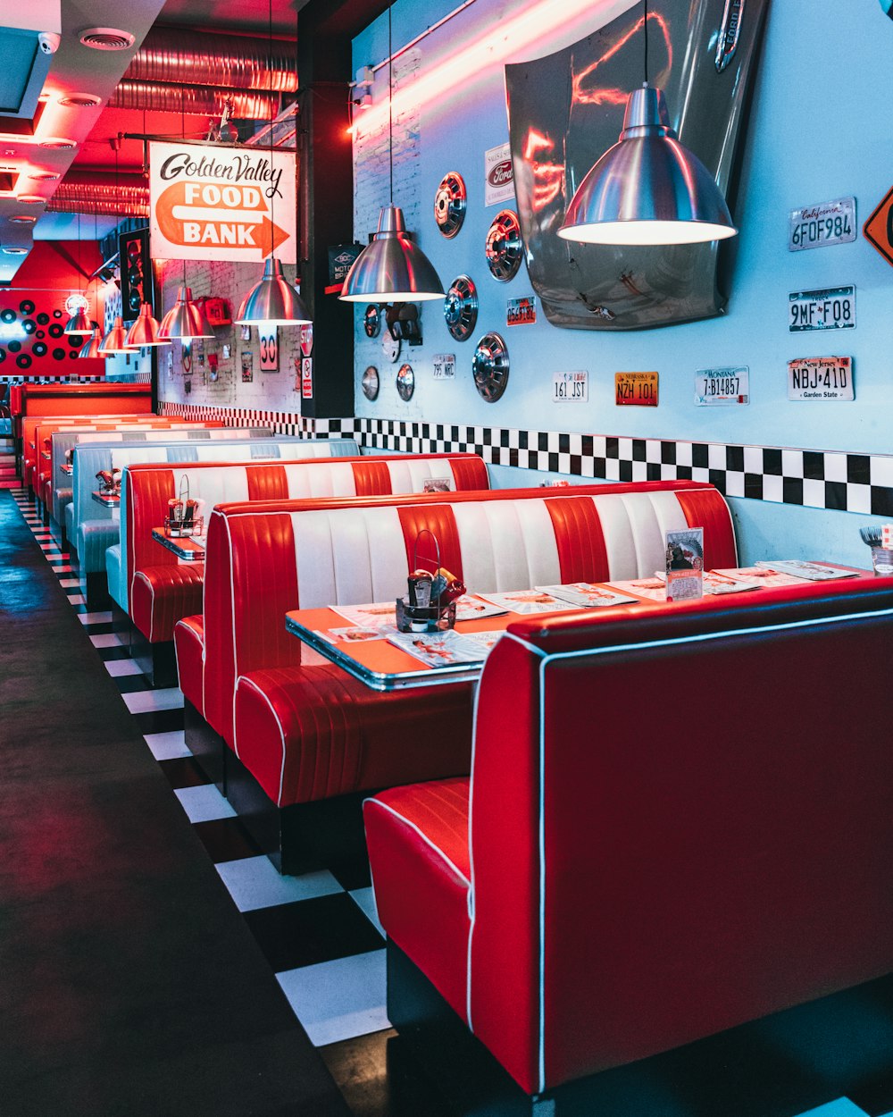 red padded sofa and tables inside building