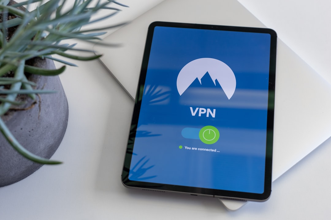 black tablet computer turned on displaying VPN, tablet on a table ready to use