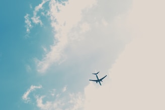 passenger plane under blue sky