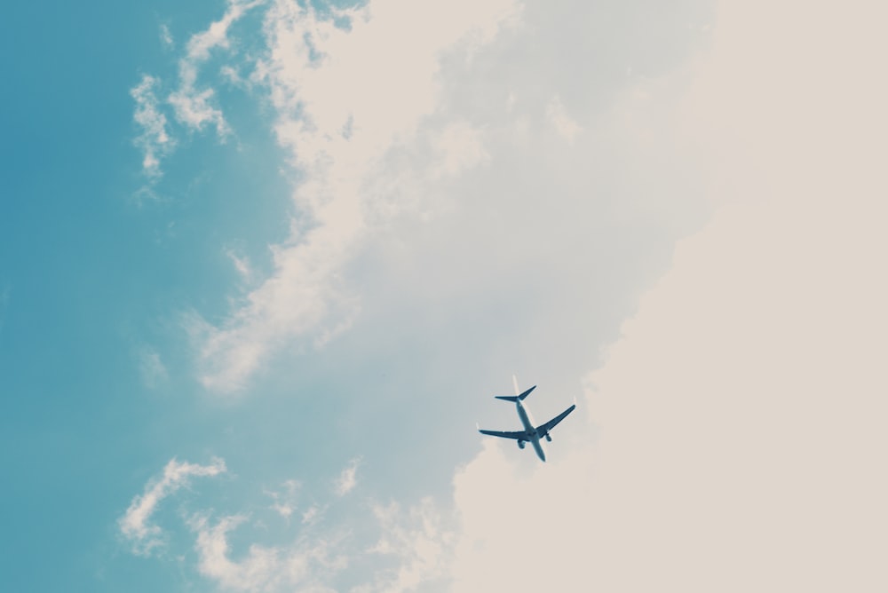 passenger plane under blue sky