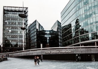 a group of people walking in front of a building