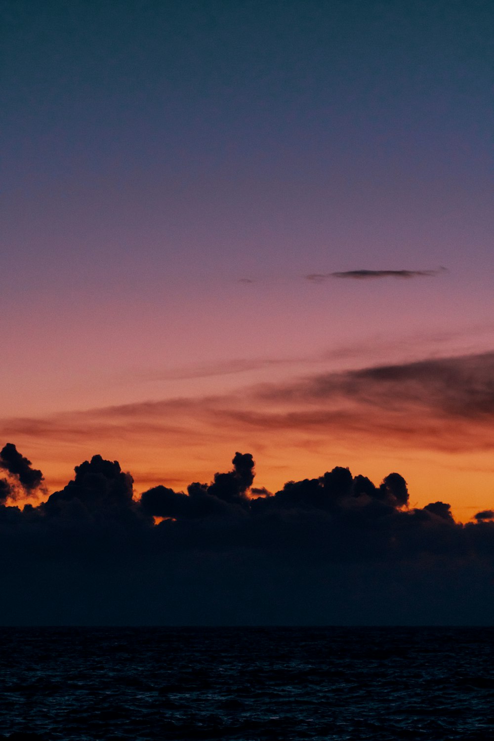 silhouette of clouds during golden hour