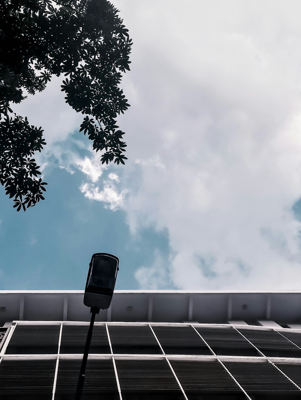 street lamp by the white and black building