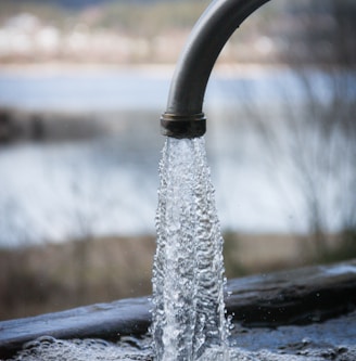 spigot with water flowing water well rehabilitation