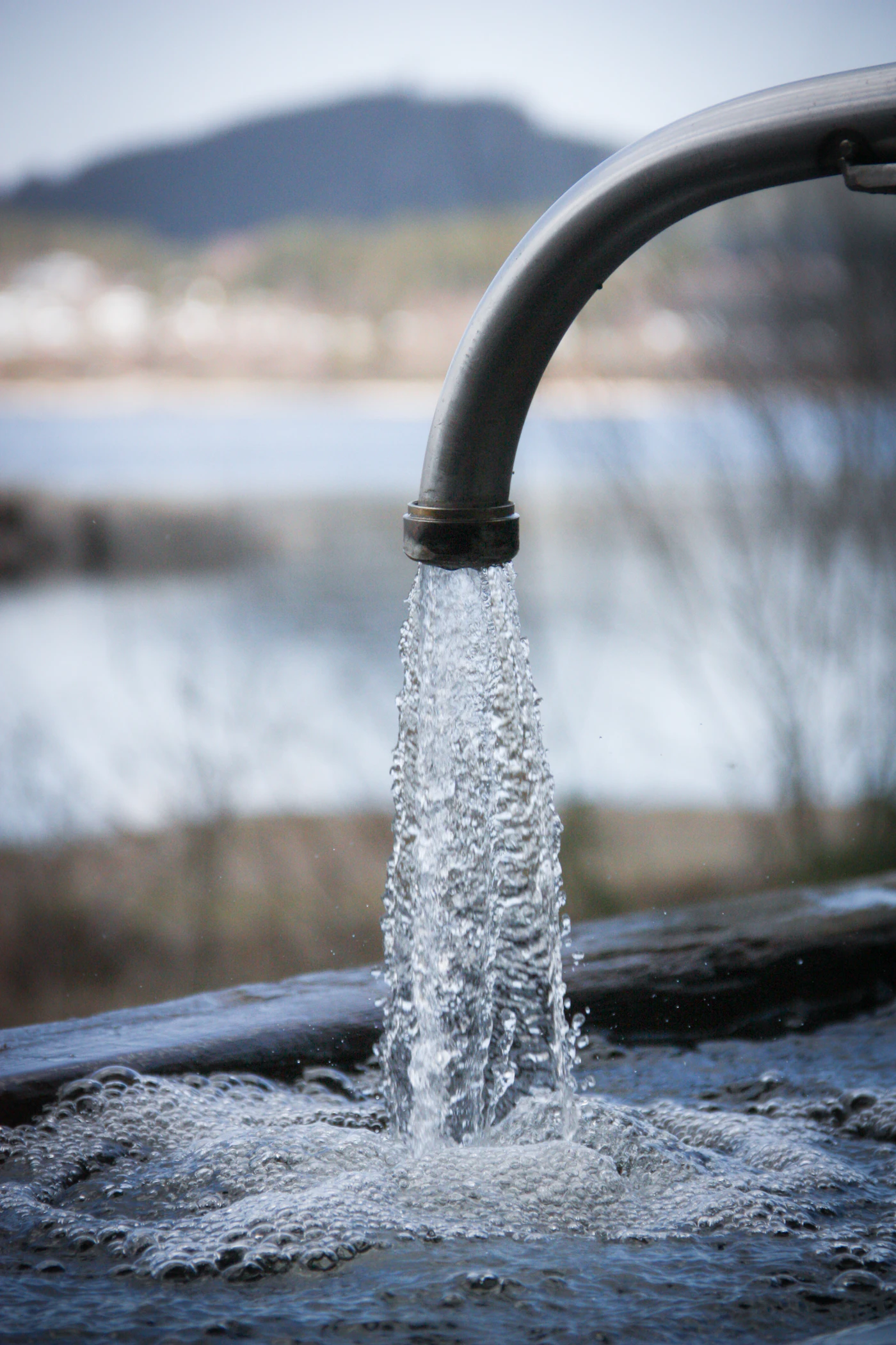 An outdoor spigot dripping water