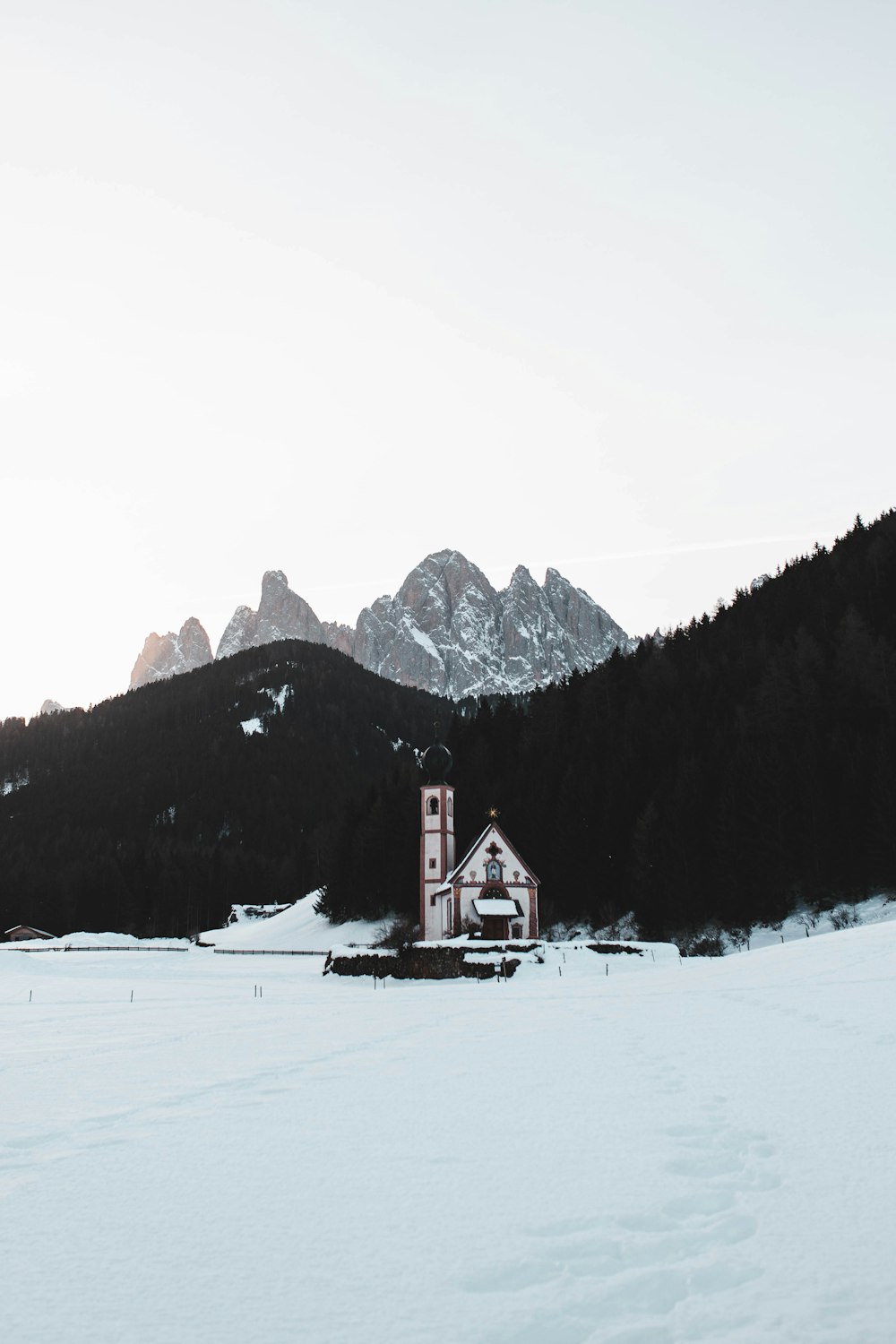 white and brown building near mountain at daytime