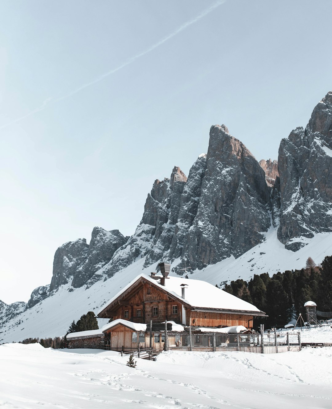 brown wooden house near the mountain