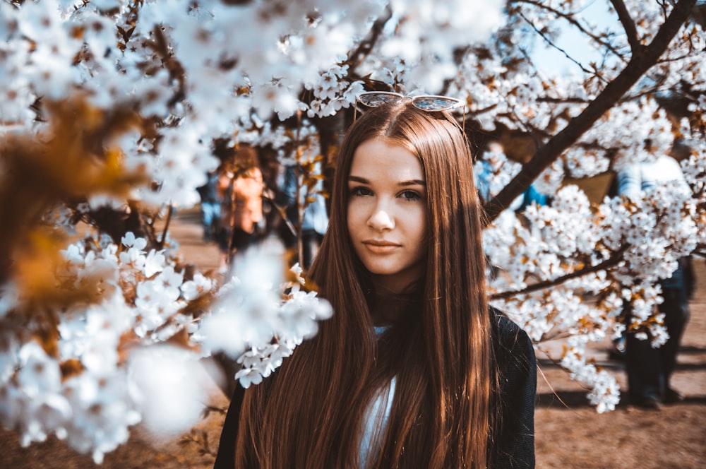 woman under cherry blossoms