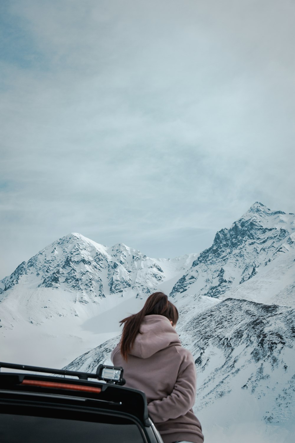 woman standing beside vehicle