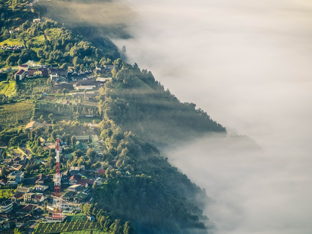 aerial photo of village beside mountain