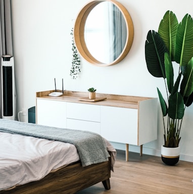 white wooden dresser with mirror