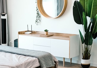 white wooden dresser with mirror