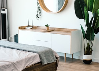 white wooden dresser with mirror