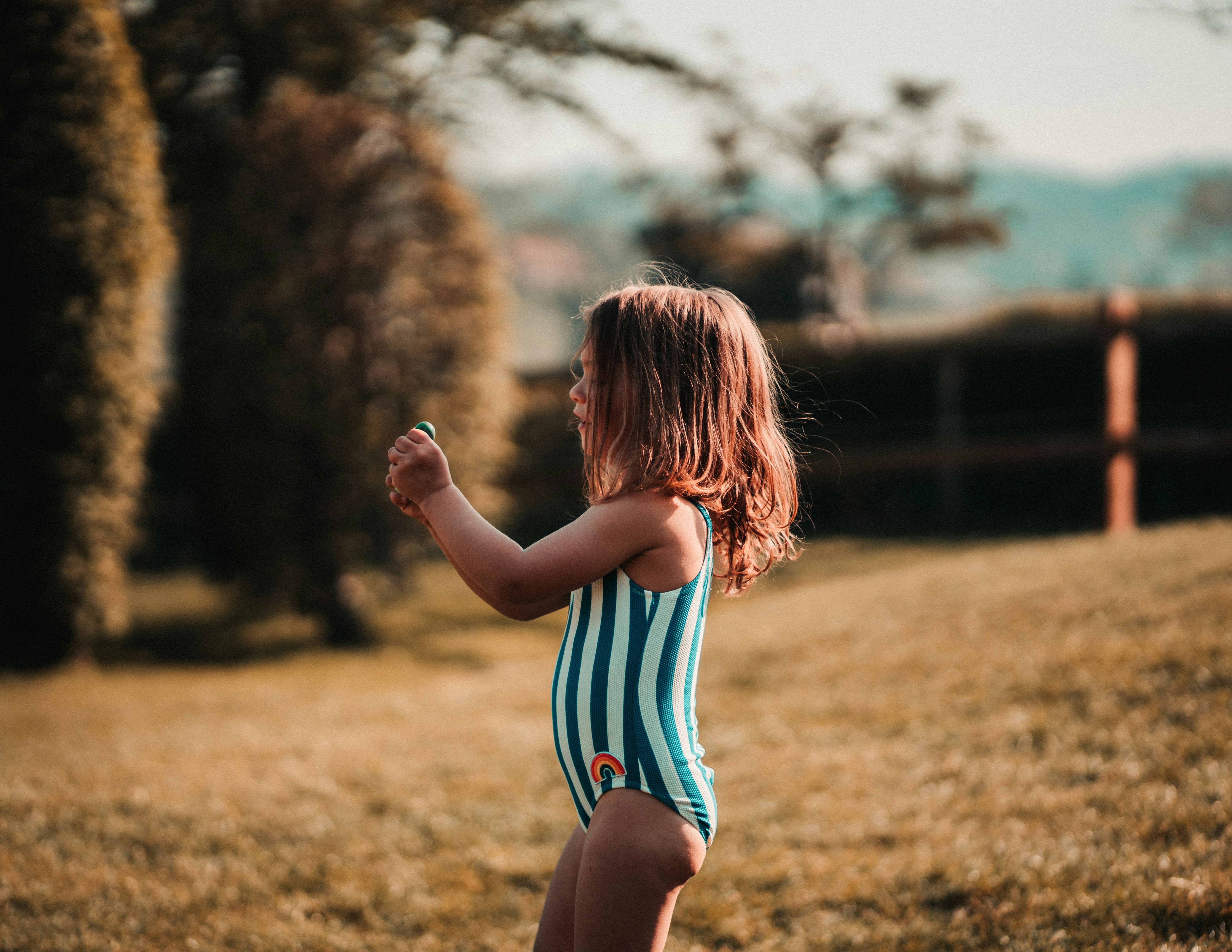 Girl Wearing Blue And White Striped One Piece Swimwear While